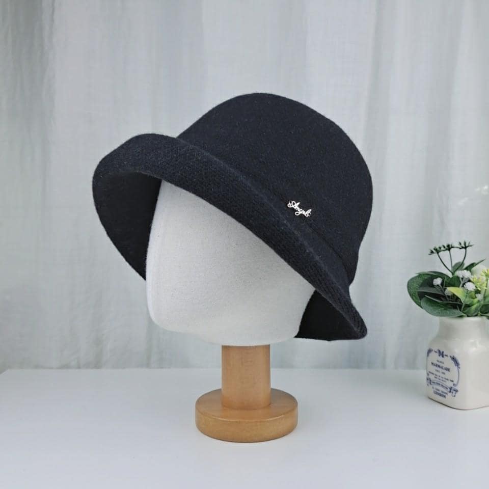Black colorful wool bucket hat with a subtle silver embellishment, displayed on a mannequin head.